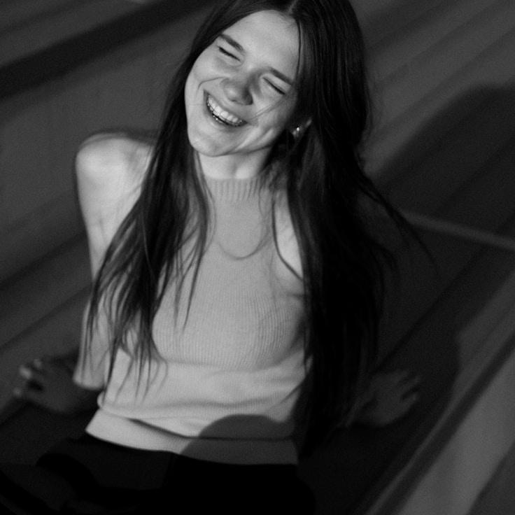 Aria Chen, Lead Design Curator at QuantosFeralis, reviewing corporate floral arrangements